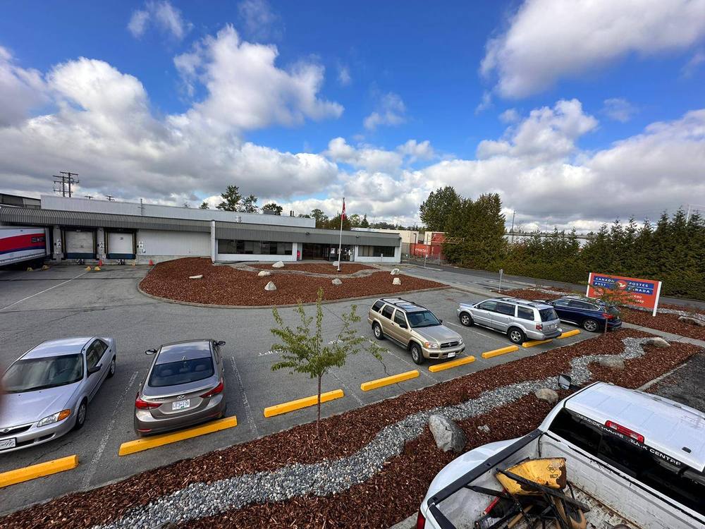 Completed landscaping, bike shelter, and repaving project, Langley BC